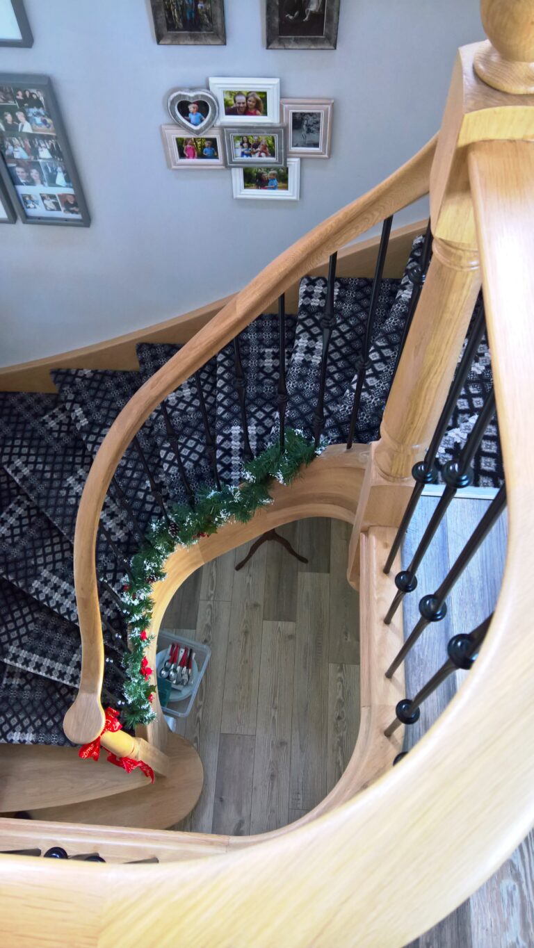 Bespoke Staircases in Isle of Wight by The Staircase Factory - a wooden staircase with metal spindles