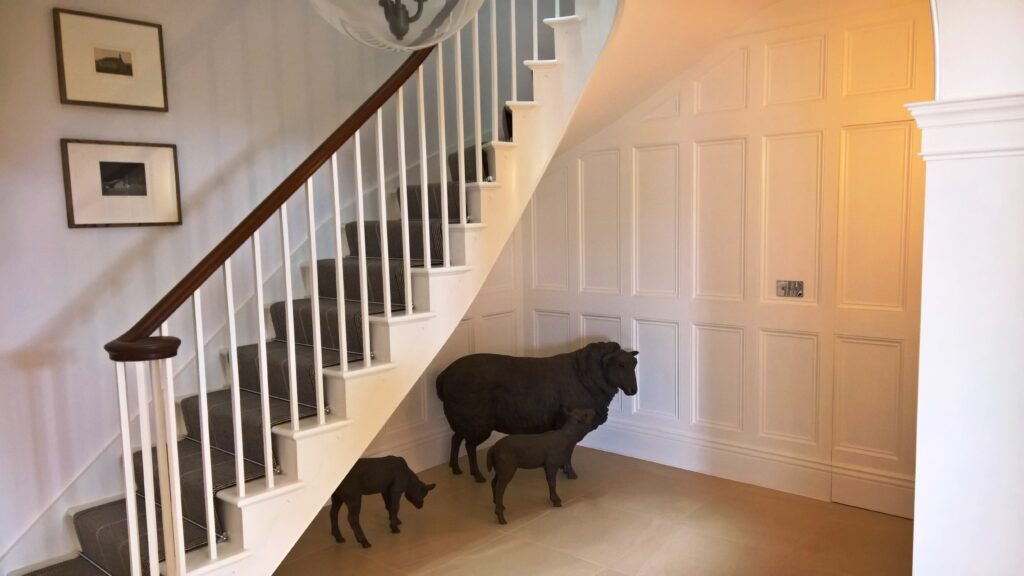 Wooden Staircases Ryde - a bespoke wooden handrail and white spindle staircase by The Staircase Factory