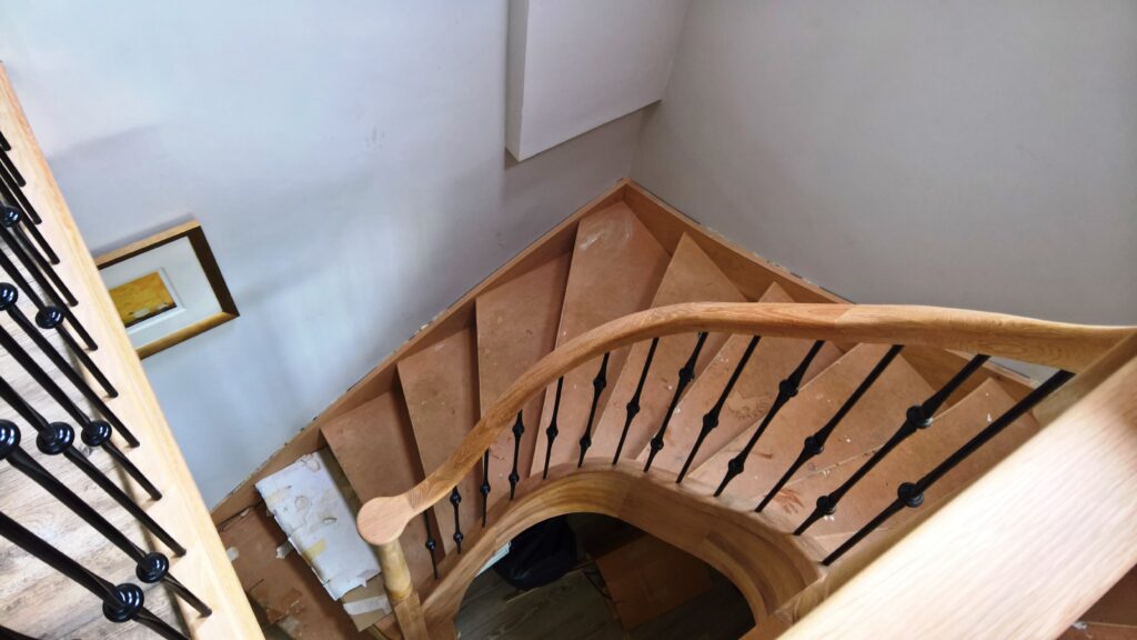 curved stairs with metal balustrade