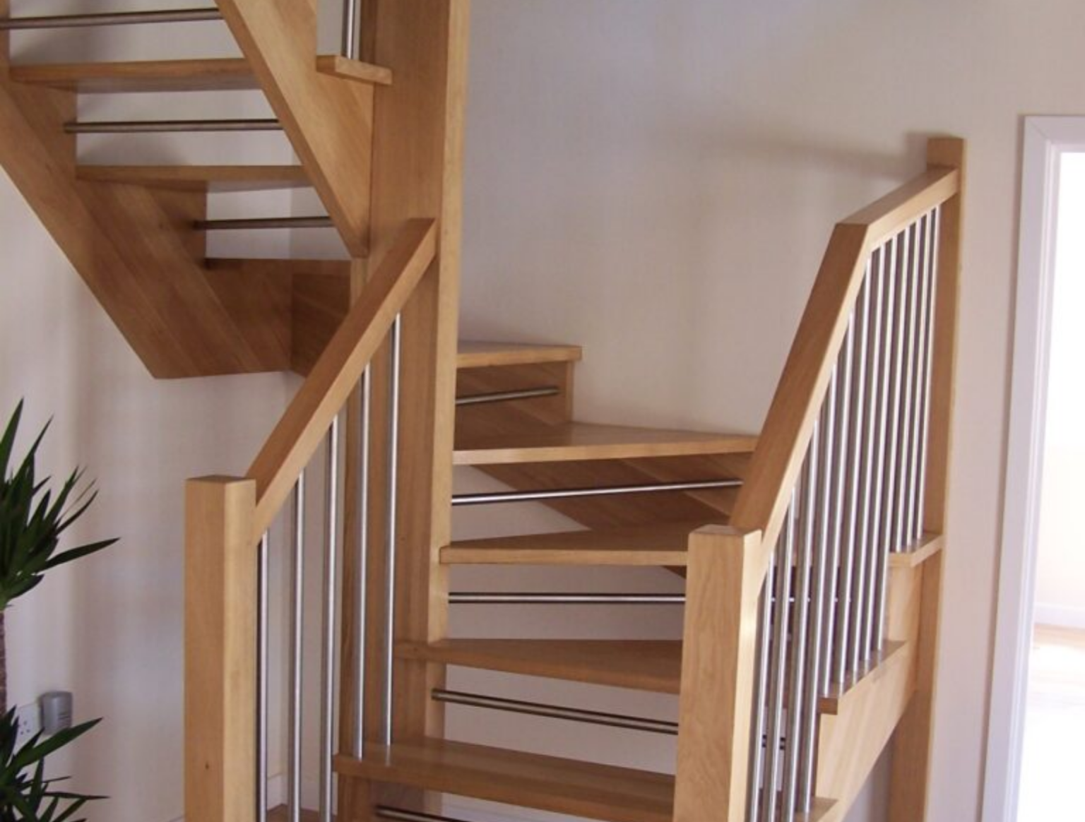 A wooden staircase with metal spindles installed in Ryde