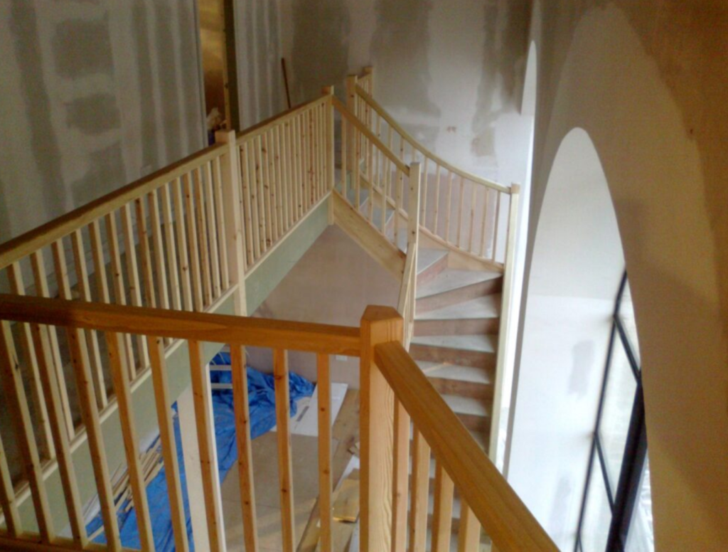 A galleried feature wooden staircase project in progress on the Isle of Wight